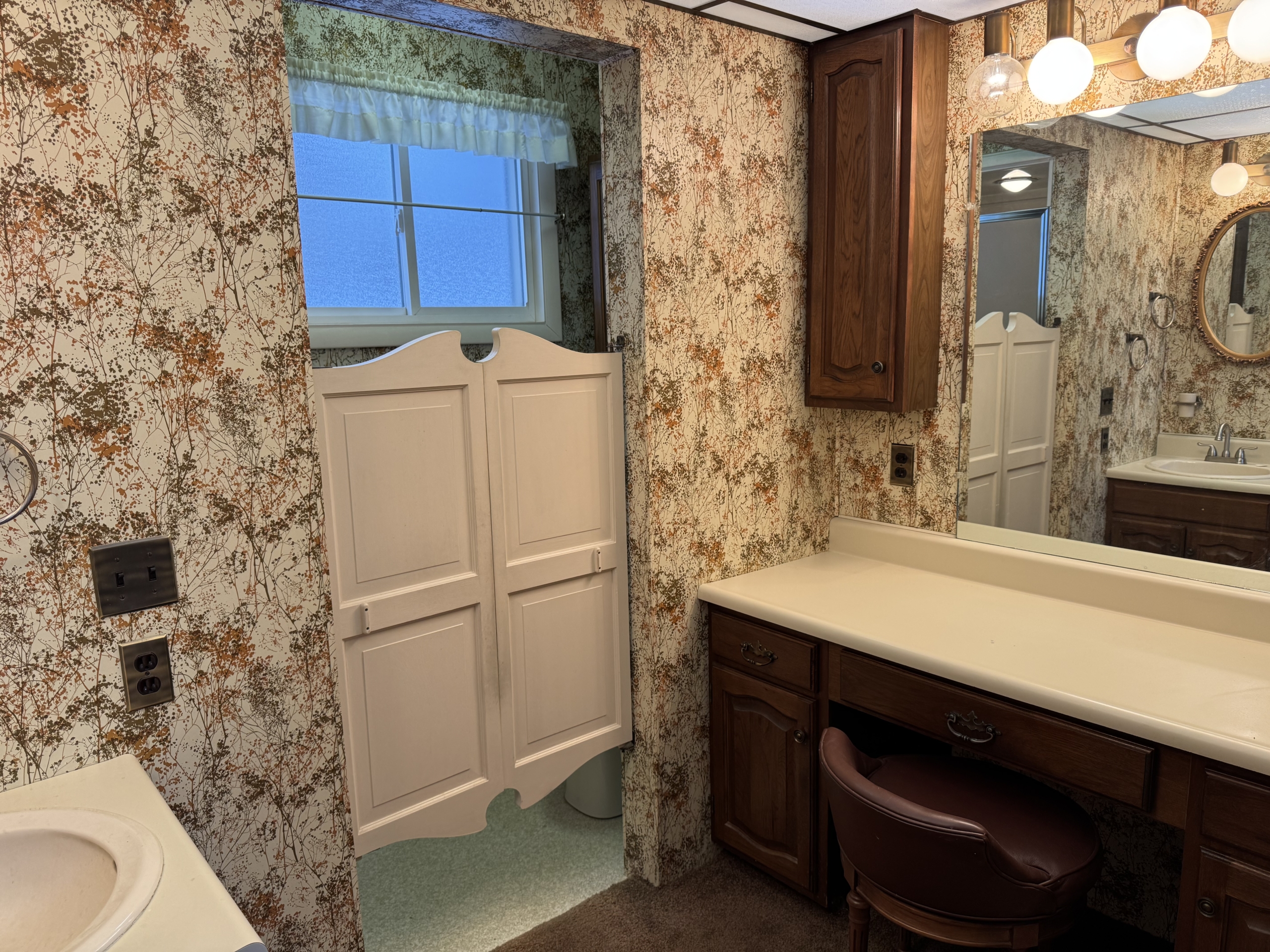 Downstairs bath doors to shower and toilet